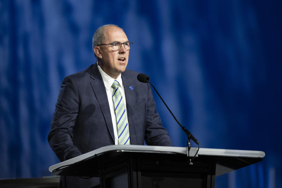 Bart Barber, Southern Baptist Convention president addresses the audience during a Southern Baptist Convention annual meeting Tuesday, June 11, 2024, in Indianapolis. (AP Photo/Doug McSchooler)