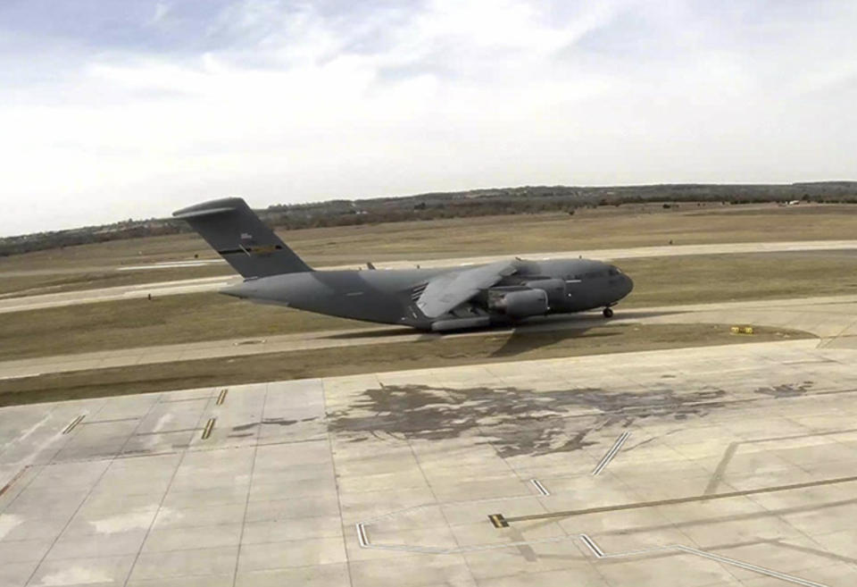 This photo provided by the City of Stillwater shows a U.S. Air Force C17 Globe Master aircraft at Stillwater Regional Airport on Sunday, Dec. 18, 2022, in Stillwater, Okla. According to city officials, the airfield was damage after the aircraft landed at the airport chartering the U.S. Air Force Women’s Basketball Team to the game against Oklahoma State University. Air Force officials say the cause of the damage is not known at this time. (City of Stillwater via AP)