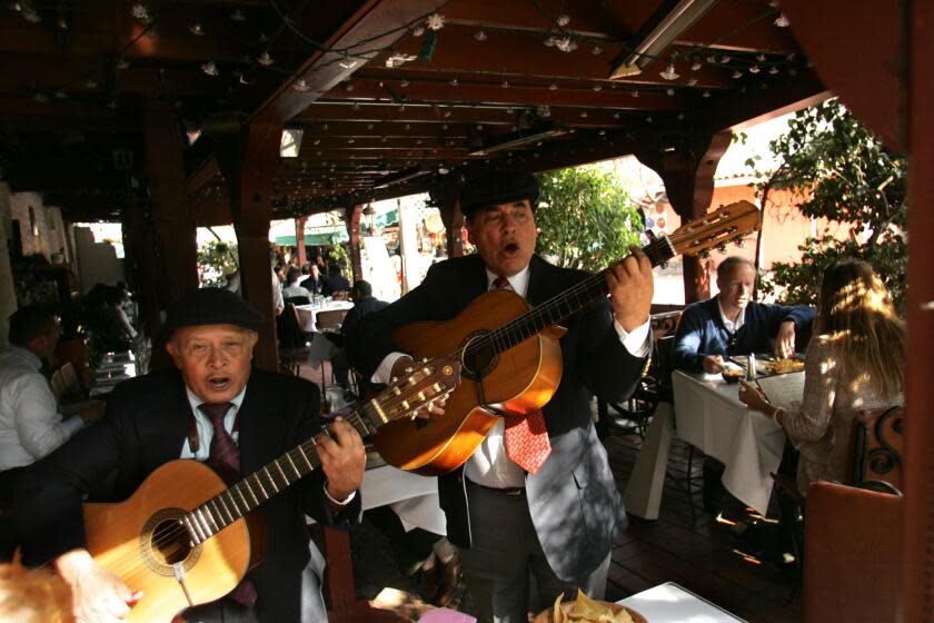 Molina, Genaro –– – 107202.ME.0201.hepatitis1.GEM (l to r) Eladio Giron and Ruben Becerra sing for patrons of La Golondrina Cafe on Olvera Street in El Pueblo de Los Angeles in downtown Los Angeles Wednesday afternoon. County officials found at least 10 people who had Hepatitus A ate there in September. County officials came to the restaurant and didn't find anything wrong according to restaurant manager Almy Leon. The restaurant currently has an "A" rating.