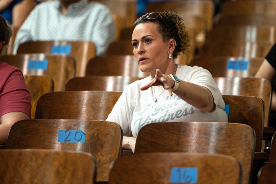 Fort Worth resident Katie May asks about how Fort Worth ISD is helping economically disadvantaged campuses during a FWISD community listening session at Daggett Middle School in Fort Worth on Thursday.