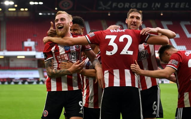 Oli McBurnie celebrates scoring Sheffield United's third goal 