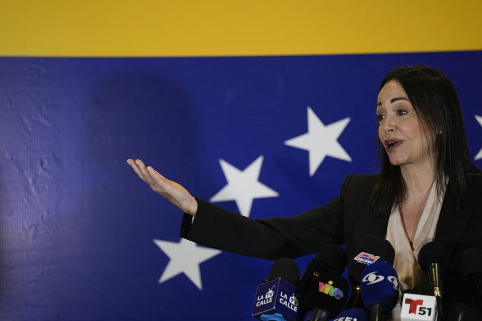 María Corina Machado, a former lawmaker and longtime government foe, speaks to the press in Caracas, Venezuela, Tuesday, Oct. 24, 2023. Machado continued to dominate the primary election held to pick the opposition's candidate to challenge Venezuelan President Nicolás Maduro next year, holding her support above 90% in the latest partial returns announced Monday. (AP Photo/Ariana Cubillos)