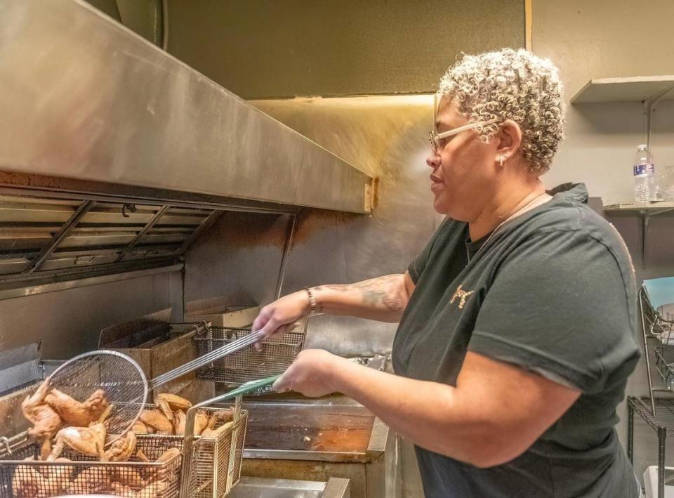 Owner Dwanda Lee-Smith, aka Miss D, fries up some chicken at Just Chicken N Beer.