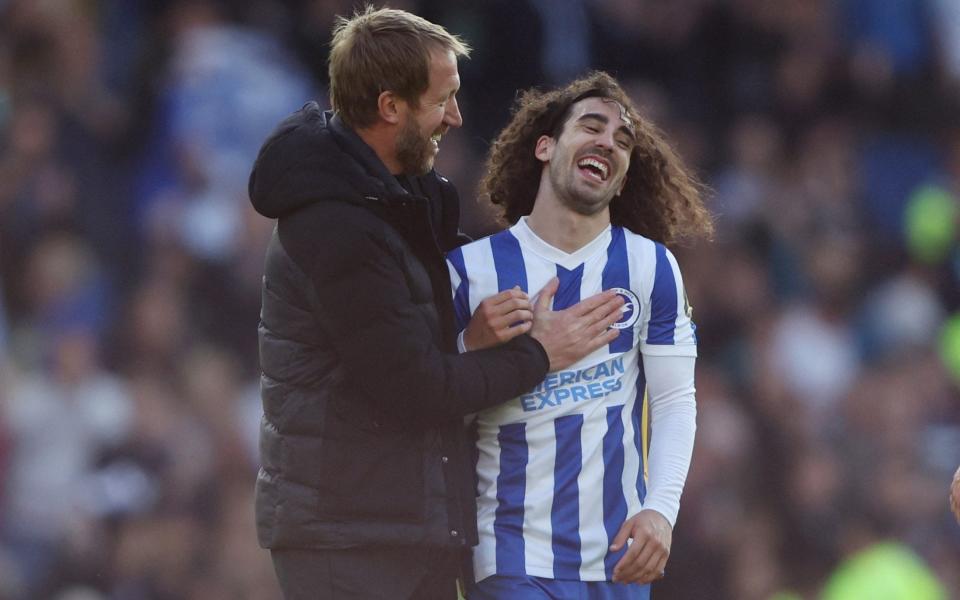 Brighton & Hove Albion manager Graham Potter and Marc Cucurella celebrate after the match - Reuters