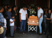 Relatives of a man who died in an explosion of a fuel pipeline ruptured by oil thieves carry his coffin after a funeral mass at a church in the municipality of Tlahuelilpan, state of Hidalgo, Mexico January 21, 2019. REUTERS/Mohammed Salem