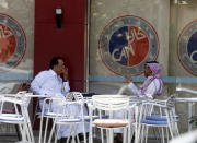 Saudi men sit at a cafe in Riyadh, Saudi Arabia, April 25, 2016. REUTERS/Faisal Al Nasser