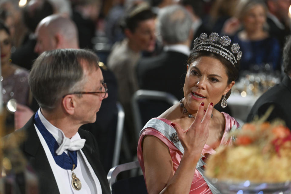 FILE - Nobel Prize laureate in Physiology or Medicine Svante Paabo and Sweden's Crown Princess Victoria attend the Nobel Prize Banquet at the Town Hall in Stockholm, Saturday Dec. 10 2022. (Pontus Lundahl/TT via AP, File)
