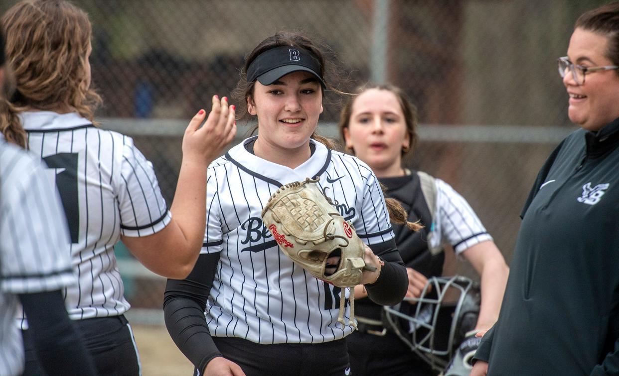 Bellingham pitcher Jarobi Houston greeted by teammates after a strong inning against Millis, April 10, 2024.