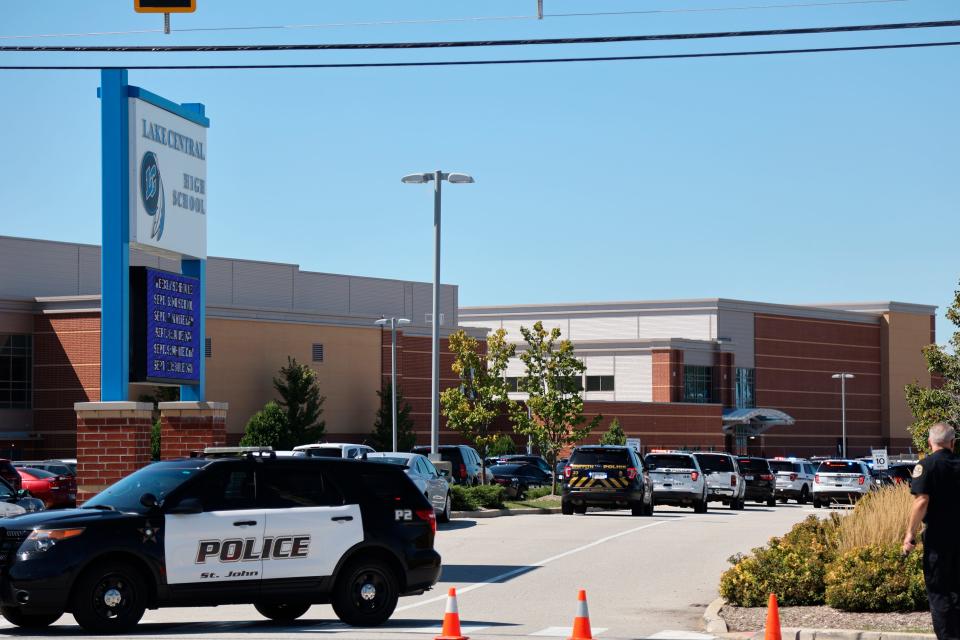Police rush to Lake Central High School after a report of an active shooter Wednesday morning, Sept. 8, 2021 in St. John, Ind. No shots were fired, according to school officials.