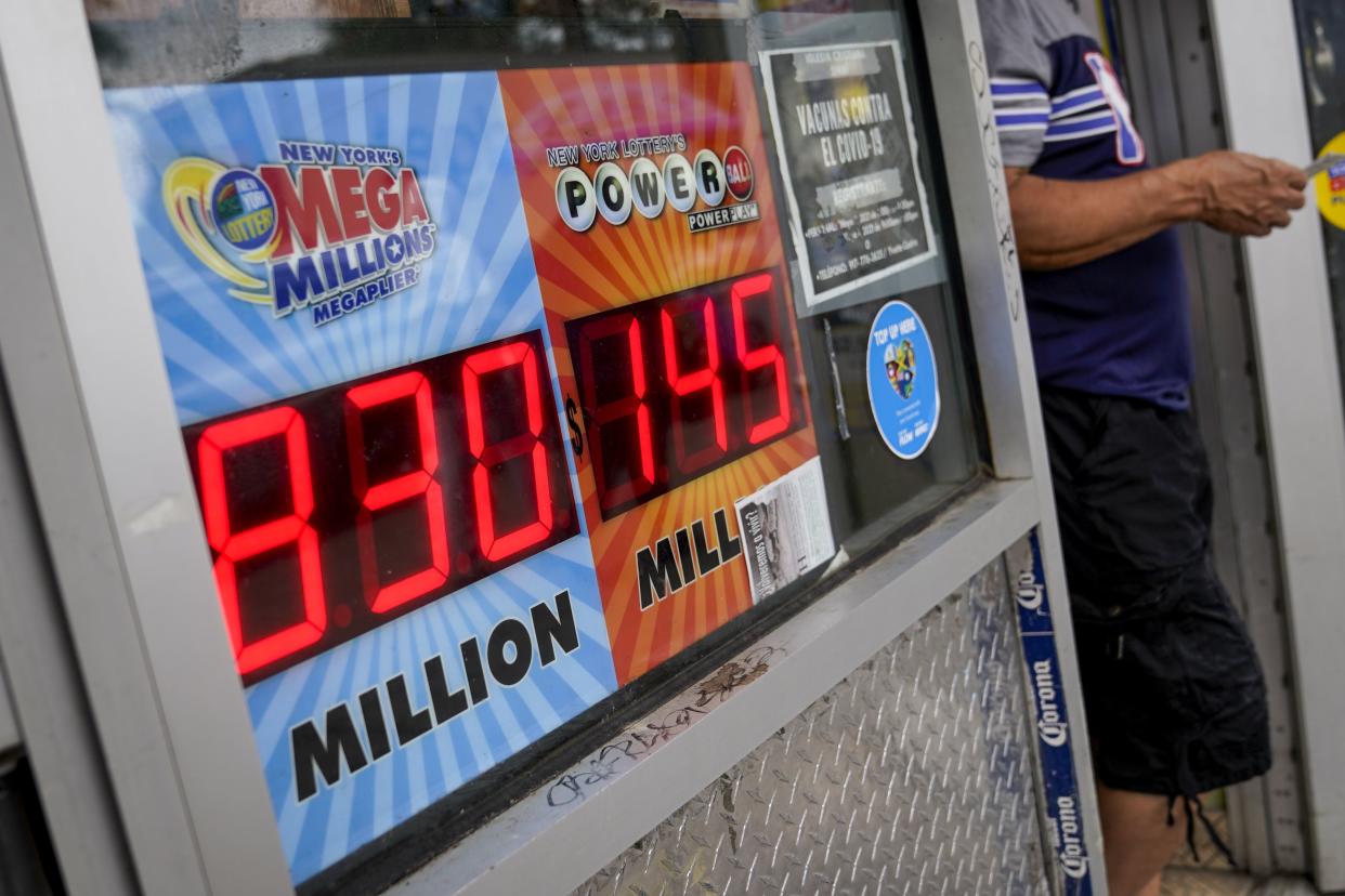 The Mega Millions lottery jackpot is advertised outside a smoke shop in Bushwick.