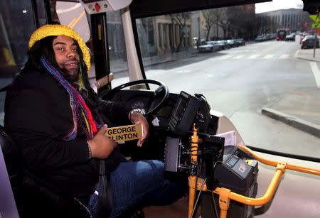 James Hylton, a Cleveland regional Transit Authority Trolley driver sits in his driver seat dressed as George Clinton as part of the Rock and Roll Hall of Fame Induction week in Cleveland, Ohio April 15, 2015. REUTERS/Aaron Josefczyk