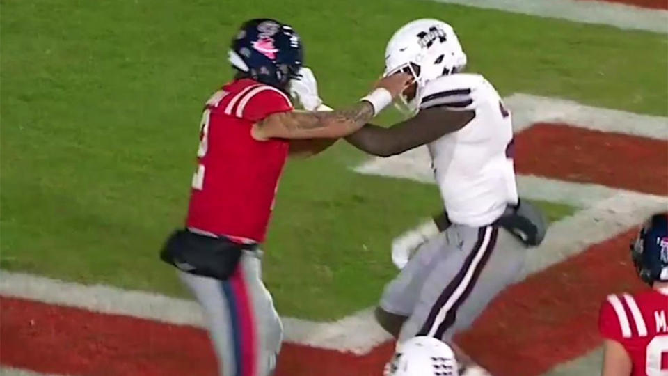 Mississippi State and Ole Miss players go at it. Pic: Getty