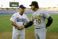 Tommy Lasorda of the Los Angeles Dodgers shakes hands with manager Tony LaRussa of the Oakland Athletics at home-plate before game 2 of the 1988 World Series, October 16, 1988 at Dodger Stadium in Los Angeles, California. The Dodgers won the series 4-1. (Photo by Focus on Sport/Getty Images)