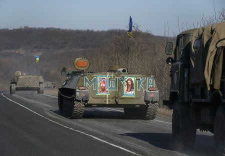 Military vehicles of the Ukrainian armed forces are seen near Artemivsk, eastern Ukraine, February 25, 2015. REUTERS/Gleb Garanich