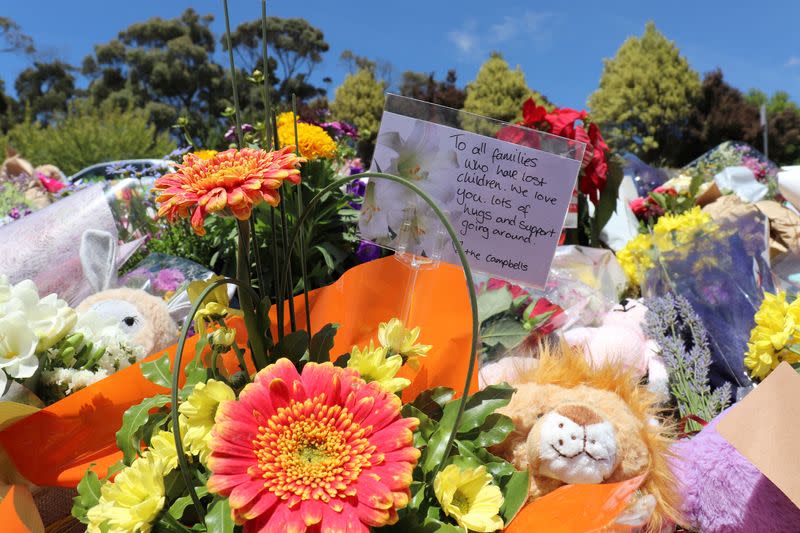 Flowers and tributes are seen outside Hillcrest Primary School in Devonport, Tasmania