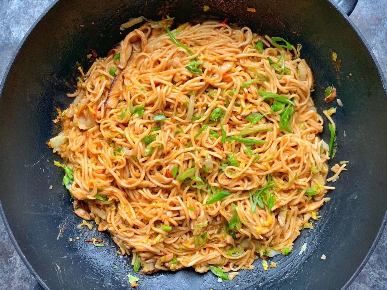 Fresh lo mein noodles are stir-fried with mushrooms, cabbage and bok choy in a rich and spicy peanut sauce laced with soy and honey. (Photo: Jake Cohen)