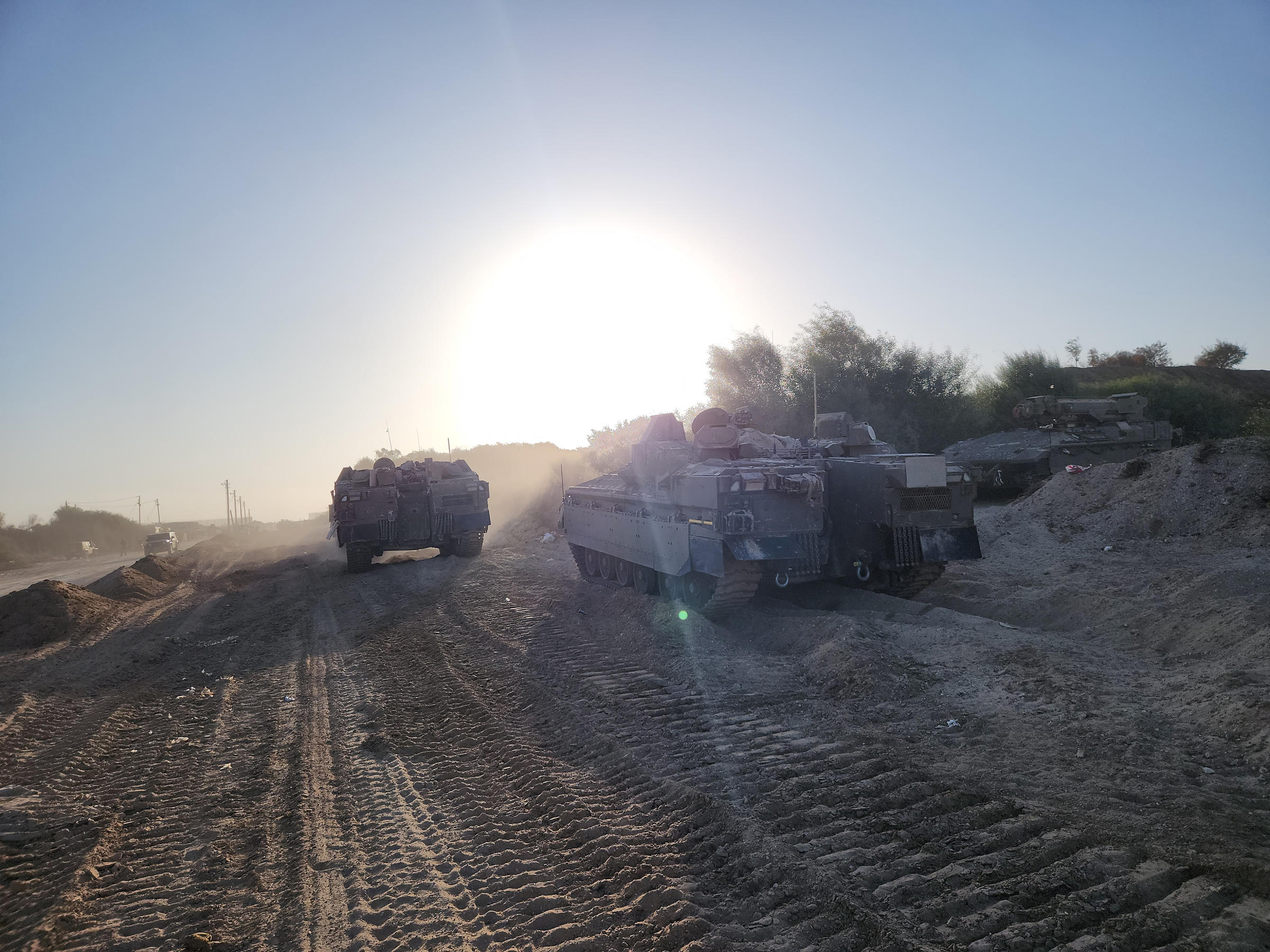 Israeli military personnel and tanks with a unit that a small group of journalists were permitted to accompany in northern Gaza for a few hours on Saturday, Nov. 4, 2023. (Ronen Bergman/The New York Times)