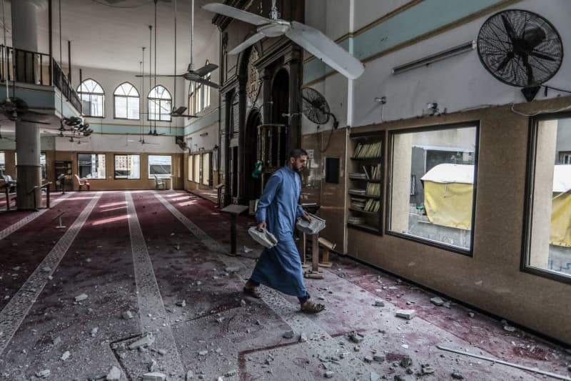 A Palestinian inspects a damaged mosque following an Israeli attack. Abed Rahim Khatib/dpa