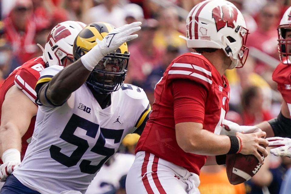 Michigan's David Ojabo sacks Wisconsin's Graham Mertz during the first half Saturday, Oct. 2, 2021, in Madison, Wisconsin.