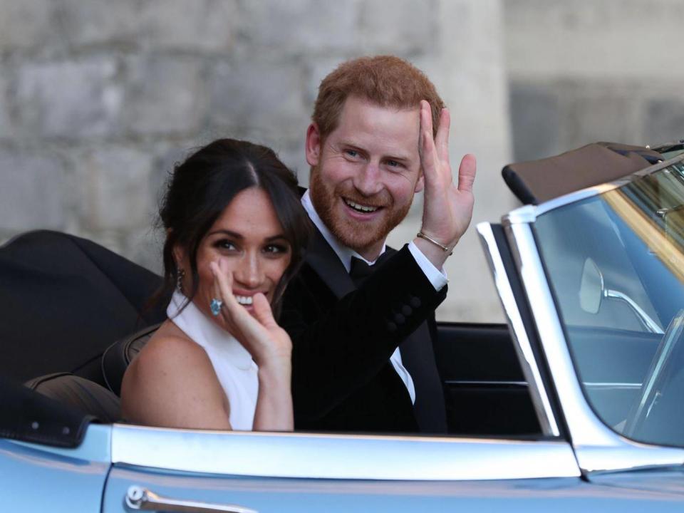 Harry and Meghan in an E-Type Jaguar after their wedding (AFP)