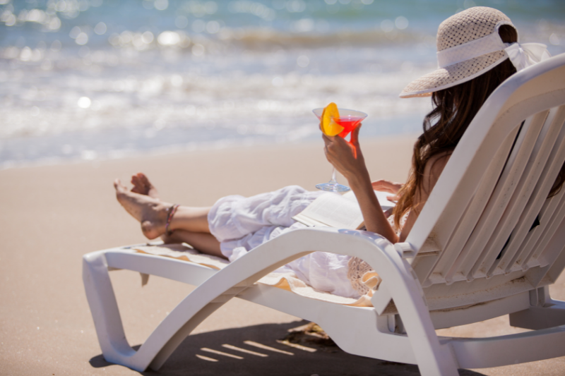 Relaxing in Deck Chair with Drink in Hand