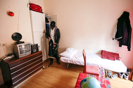 Yankouba Gassama, 21, from Gambia, is seen in his room at a shelter in Rome, Italy, November 23, 2016. Picture taken November 23, 2016. REUTERS/Max Rossi