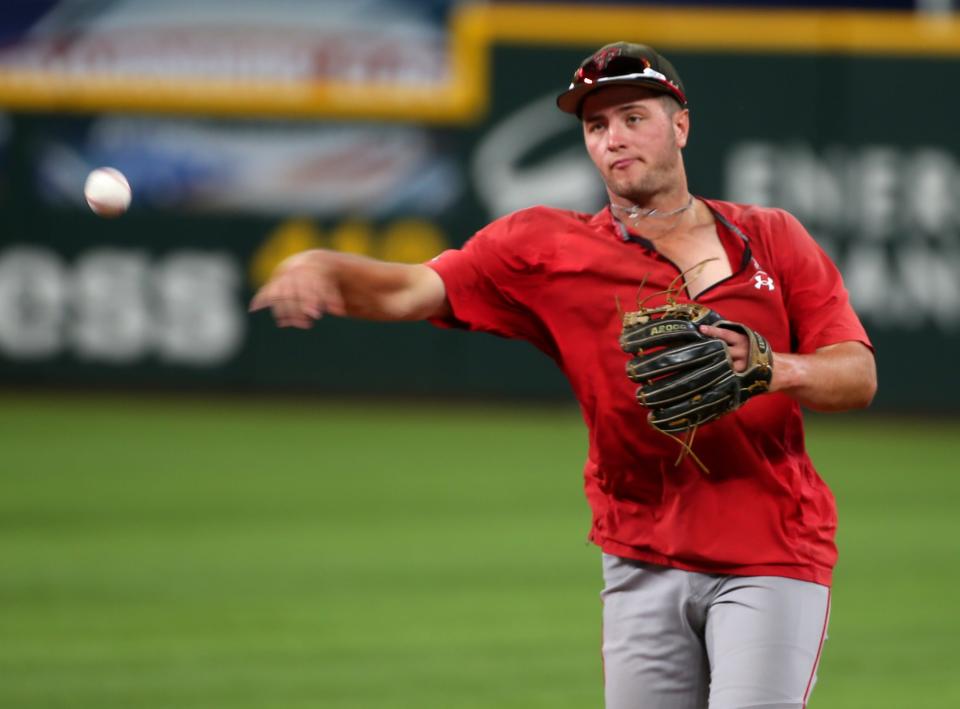 Texas Tech's Jace Jung throws the ball during practice ahead of the team's Big 12 tournament game against Kansas State, Tuesday, May 24, 2022, at Globe Life Field in Arlington.