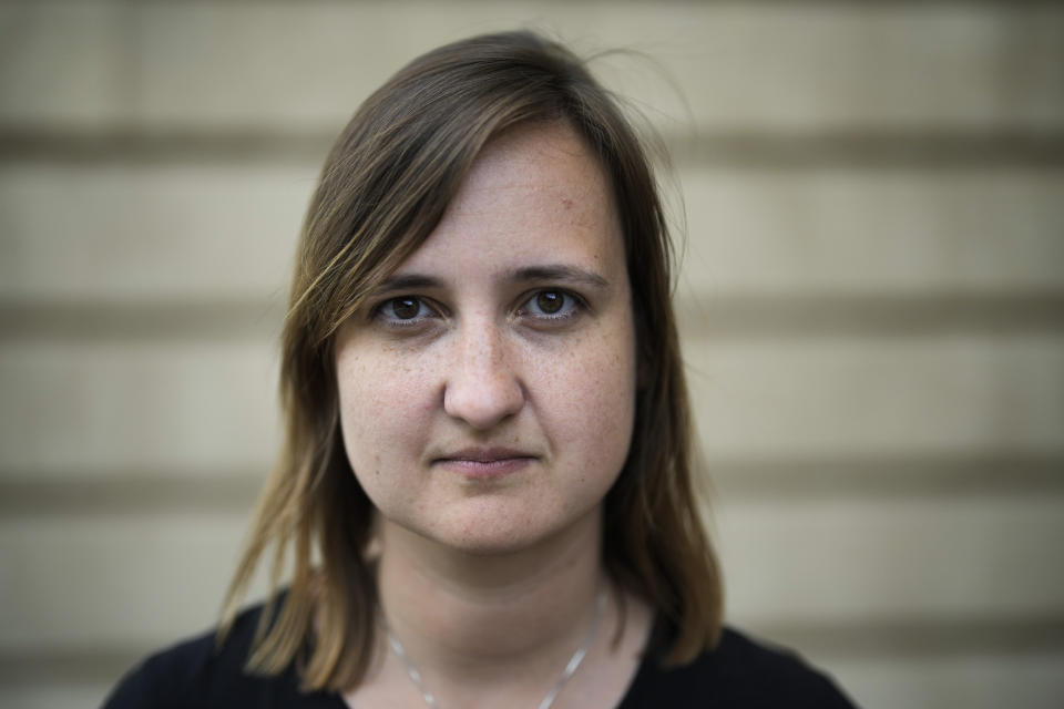 Teacher Laura Nickel poses for a portrait after an interview with The Associated Press in Cottbus, Germany, Wednesday, July 19, 2023. Two teachers in eastern Germany tried to counter the far-right activities of students at their small town high school. Disheartened by what they say was a lack of support from fellow educators, Laura Nickel and Max Teske decided to leave Mina Witkojc School in Burg. (AP Photo/Markus Schreiber)