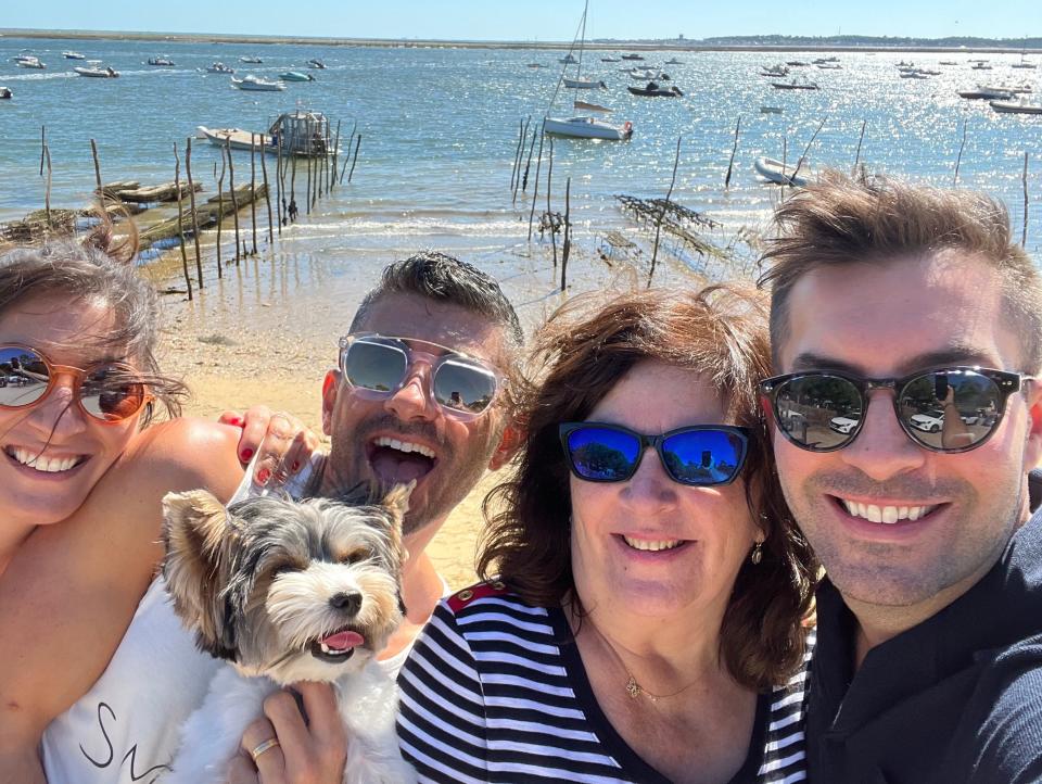 Family smiling on a beach in Cap Ferret, France