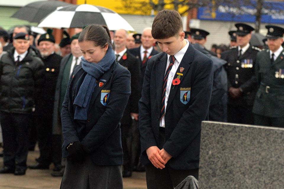 Craigavon Senior High School pupils take a moment to reflect at the War Memorial on Sunday. (Photo: Tony Hendron)