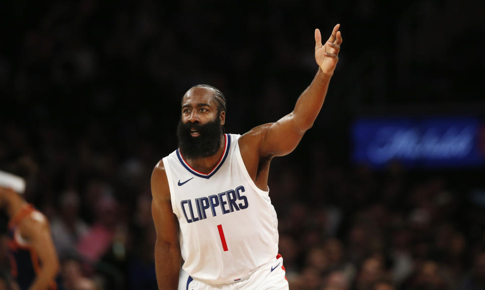 Los Angeles Clippers guard James Harden reacts to hitting a three-point shot during the first half of an NBA basketball game against the New York Knicks, Monday, Nov. 6, 2023, in New York. (AP Photo/John Munson)