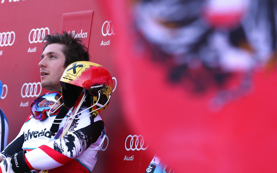 Austria's Marcel Hirscher, winner of an alpine ski World Cup men's slalom, looks up from on the podium in Adelboden, Switzerland, Sunday, Jan. 12, 2014. (AP Photo/Giovanni Auletta)