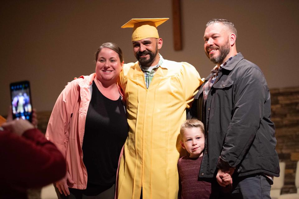 Graduate Matthew Moody poses for a photo with family after graduating from Jackson Day Reporting Center inside Englewood Baptist Church on Tuesday, Mar. 21, 2023. 