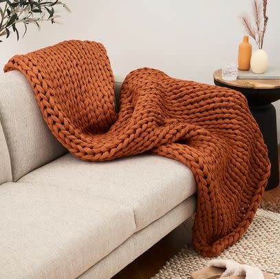 A weighted blanket with a unique knitted pattern that creates the perfect balance of breathability and heavy comfort