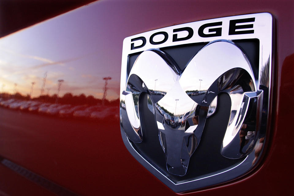 FILE- In this Aug. 15, 2010, file photo the Dodge logo is seen on a new Dodge RAM 3500 Heavy Duty pickup trucks at sunset at a dealership in Springfield, Ill. Fiat Chrysler is recalling more than 1.6 million vehicles worldwide to replace Takata front passenger air bag inflators that can be dangerous. The recall covers the 2010 through 2016 Jeep Wrangler SUV, the 2010 Ram 3500 pickup and 4500/5500 Chassis Cab trucks, the 2010 and 2011 Dodge Dakota pickup, the 2010 through 2014 Dodge Challenger muscle car, the 2011 through 2015 Dodge Charger sedan, and the 2010 through 2015 Chrysler 300 sedan. (AP Photo/Seth Perlman, File)
