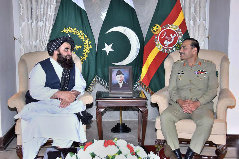 In this photo released by the Inter Services Public Relations, the Taliban-appointed Afghan Foreign Minister Amir Khan Muttaqi, left, meets with Pakistan's Army Chief General Asim Munir, in Rawalpindi, Pakistan, Sunday, May 7, 2023. (Inter Services Public Relations vis AP)