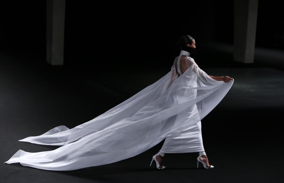 A model wears a creation by French fashion Stephane Rolland's Haute Couture Fall-Winter 2013-2014 collection presented Tuesday, July 2, 2013 in Paris. (AP Photo/Francois Mori)