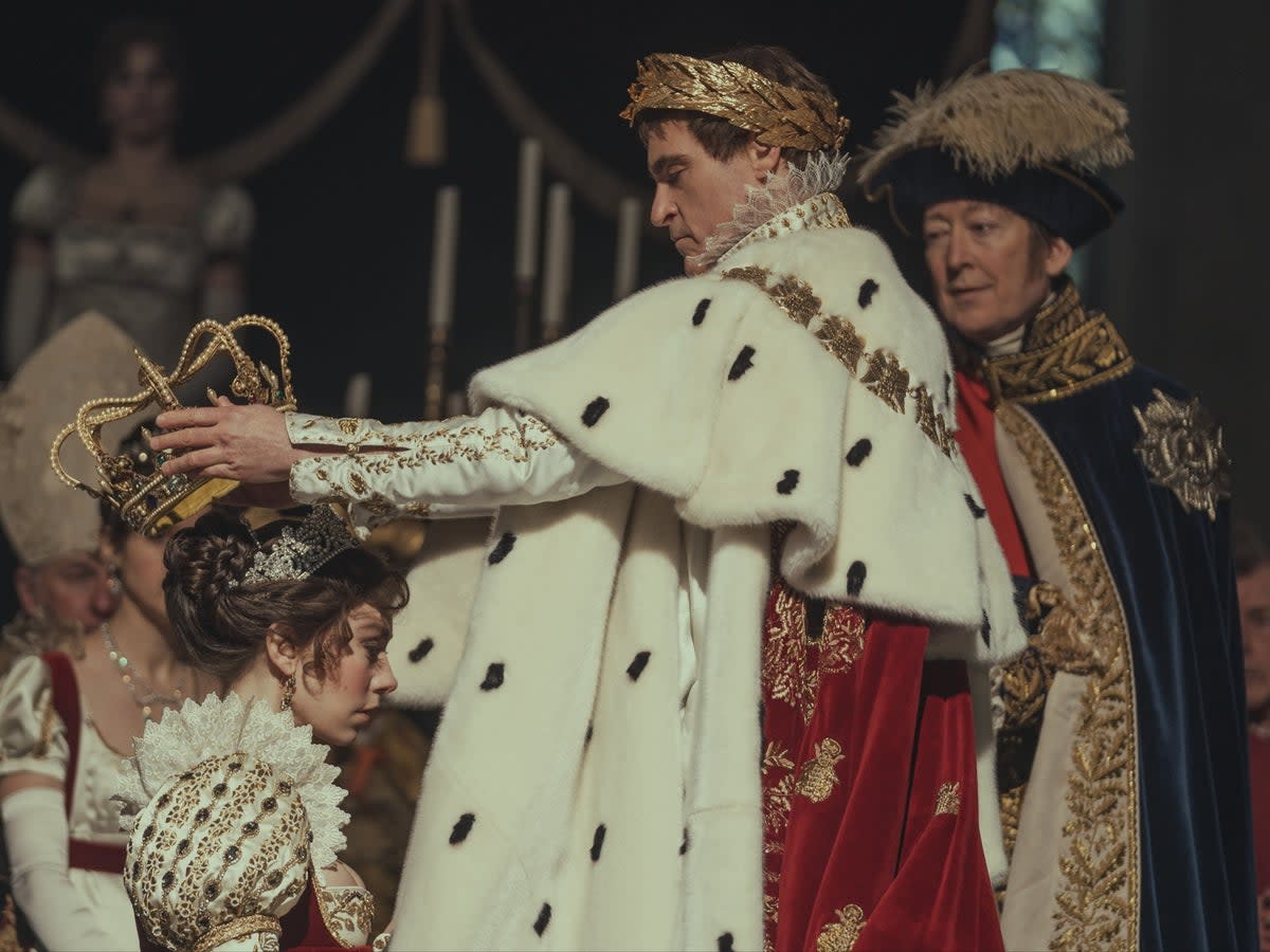 Joaquin Phoenix as Napoléon Bonaparte and Vanessa Kirby as Joséphine de Beauharnais in Ridley Scott’s ‘Napoleon’. In this scene, Bonaparte has just been crowned emperor and his wife is being crowned empress (Courtesy of Apple)