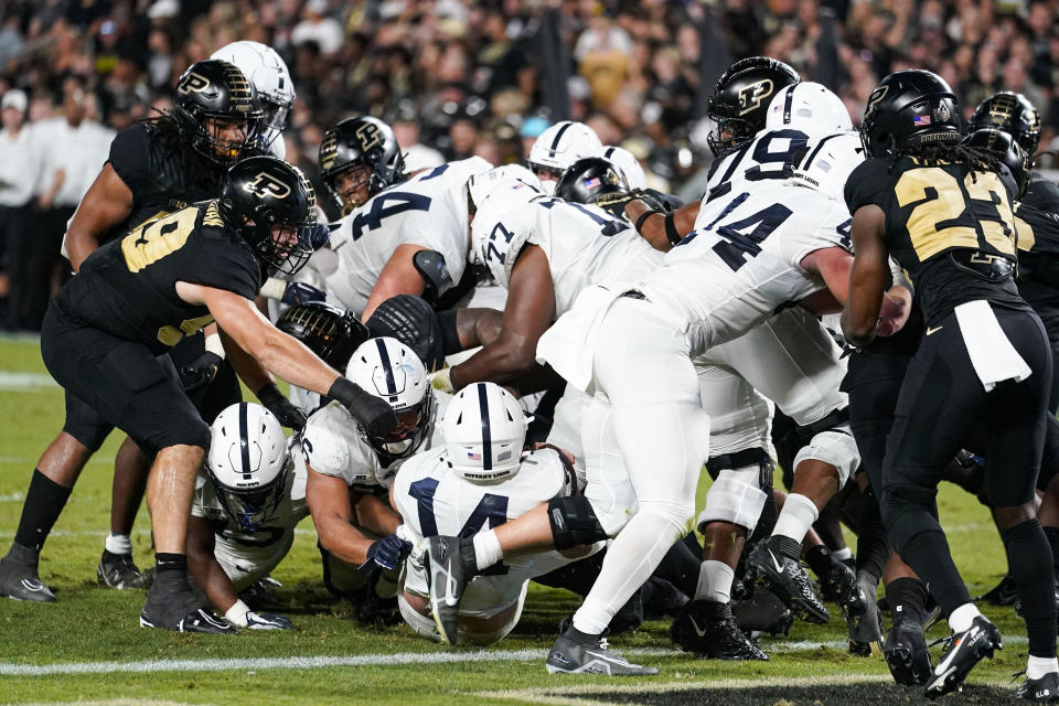 Penn State quarterback Sean Clifford (14) backs in for a touchdown during the first half of an NCAA college football game against Purdue in West Lafayette, Ind., Thursday, Sept. 1, 2022. (AP Photo/Michael Conroy)