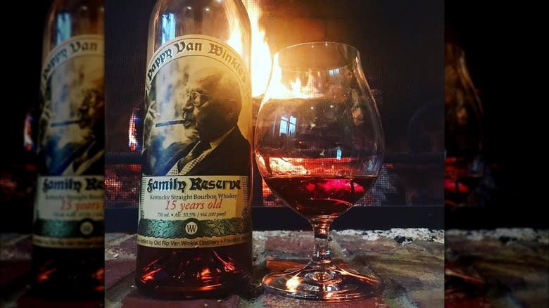 Bottle of Pappy 15 and a glass of bourbon