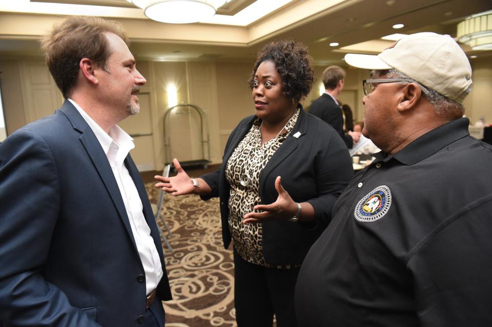 Mayor Latasha Johnson from Eutaw and Mayor Willie Lake from York talk with Michael Rasbury from the University of Alabama SafeState program in the College of Continuing Studies during a session about the Alabama Healthy Homes project Wednesday at Hotel Capstone in Tuscaloosa.