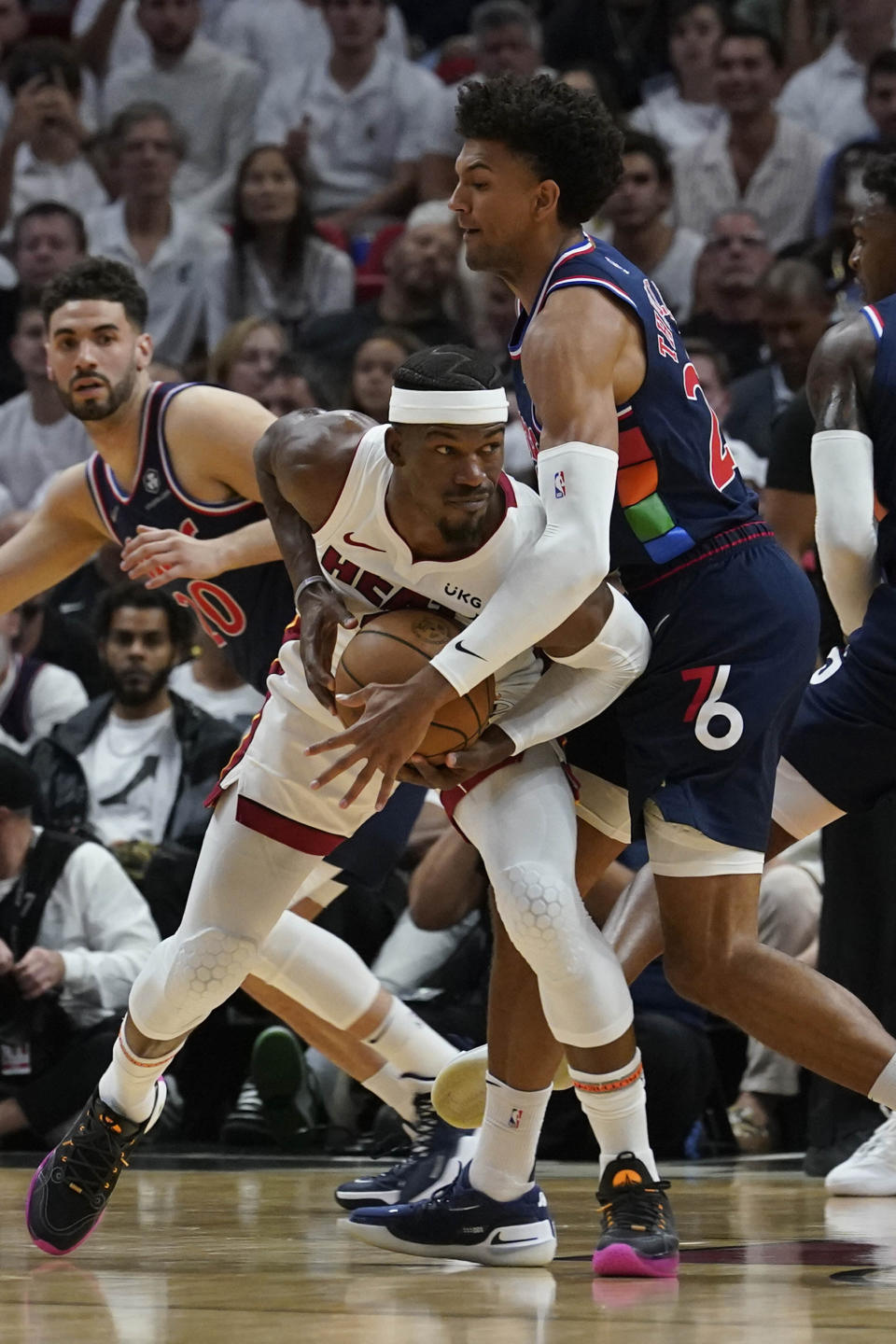 Philadelphia 76ers guard Matisse Thybulle (22) defends Miami Heat forward Jimmy Butler (22) during the first half of Game 1 of an NBA basketball second-round playoff series, Monday, May 2, 2022, in Miami. (AP Photo/Marta Lavandier)