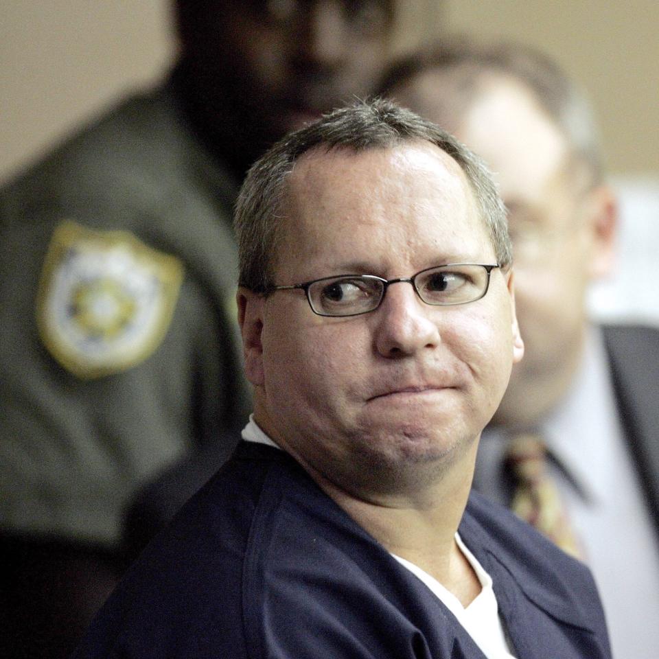 Death row inmate Duane Owen looks back at the courtroom observers before being led away August 11, 2006 at the Palm Beach Courthouse.  