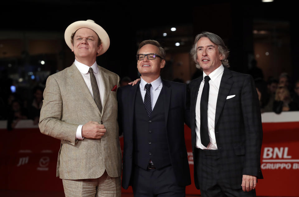 Actors John C. Reilly, left, and Steve Coogan right, pose with director Jon S. Baird during the red carpet of the movie “Stan & Ollie”, at the 13th edition of the Rome Film Fest, Wednesday, Oct. 24, 2018. (AP Photo/Alessandra Tarantino)