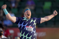 Ryan Crouser celebrates after setting a world record during the finals of men's shot put at the U.S. Olympic Track and Field Trials Friday, June 18, 2021, in Eugene, Ore. (AP Photo/Charlie Riedel)