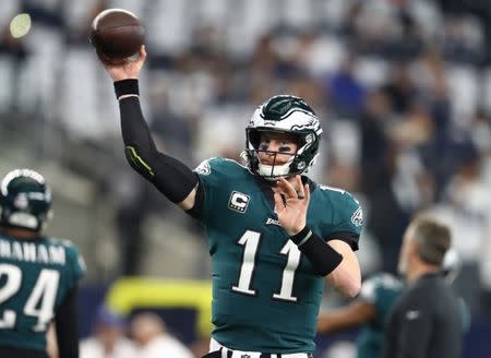 FILE PHOTO: Dec 9, 2018; Arlington, TX, USA; Philadelphia Eagles quarterback Carson Wentz (11) throws prior to the game against the Dallas Cowboys at AT&T Stadium. Mandatory Credit: Matthew Emmons-USA TODAY Sports