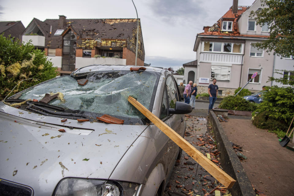 A damaged car is seen after a storm in Paderborn, Germany, Friday, May 20, 2022. (Lino Mirgeler/dpa via AP)