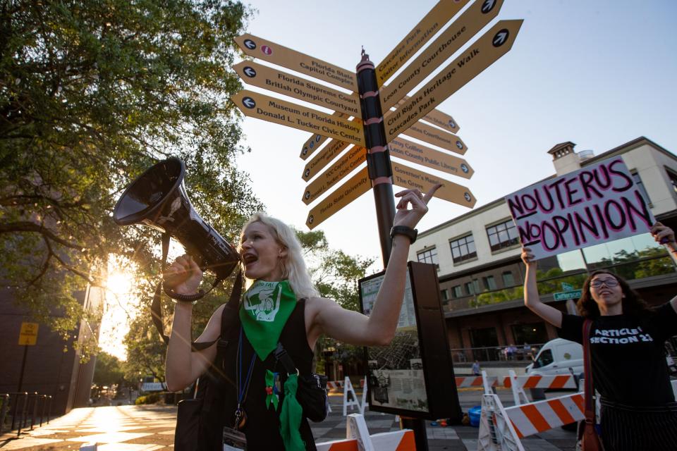 A group of roughly 40 activists gathered outside the Tallahassee City Hall building to protest SB 300, which would place a ban on abortions after six weeks, on Monday, April 3, 2023. The bill was passed by the senate earlier in the day. 