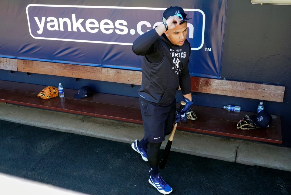 New York Yankees infielder Oswald Peraza leaves the dugout for batting practice during a spring training baseball workout, Sunday, March 13, 2022, in Tampa, Fla. (AP Photo/John Raoux)