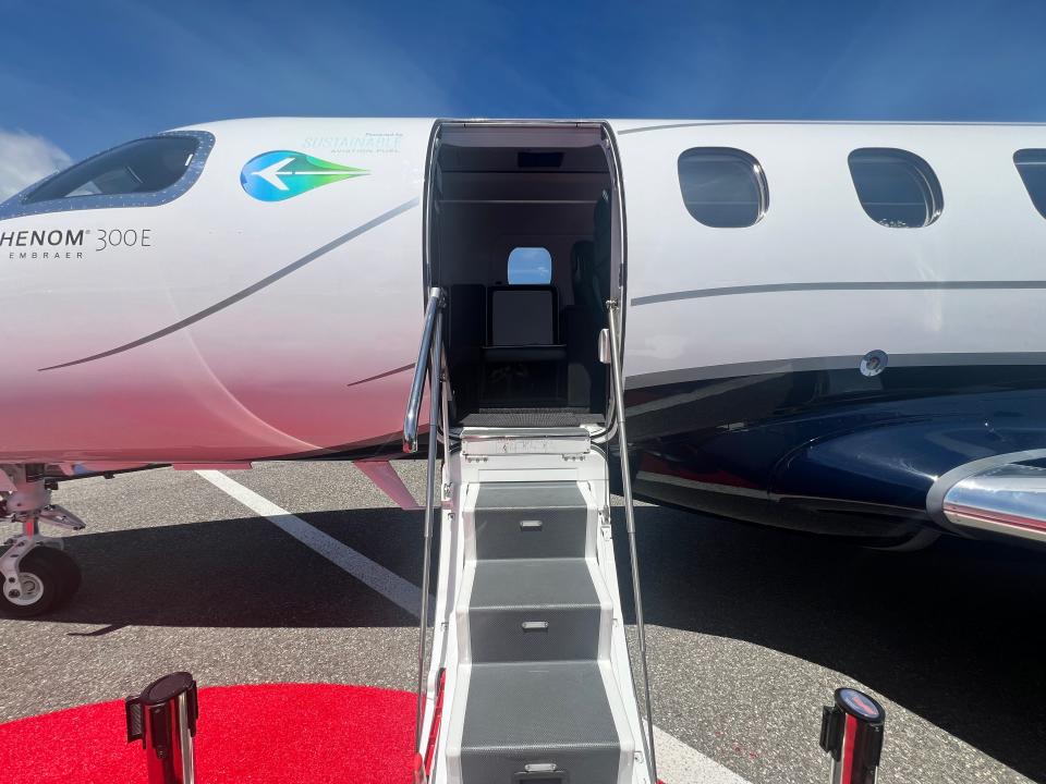 The steps leading up to the door of an Embraer Phenom 300E